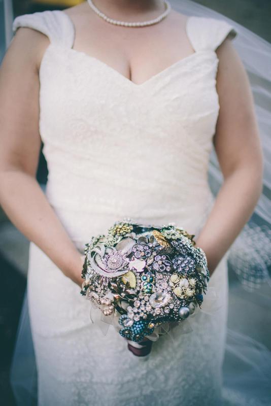 Intricate metallic brooch wedding bouquet with delicate silver and gold details, highlighting Forever Flowers by Val's unique craftsmanship